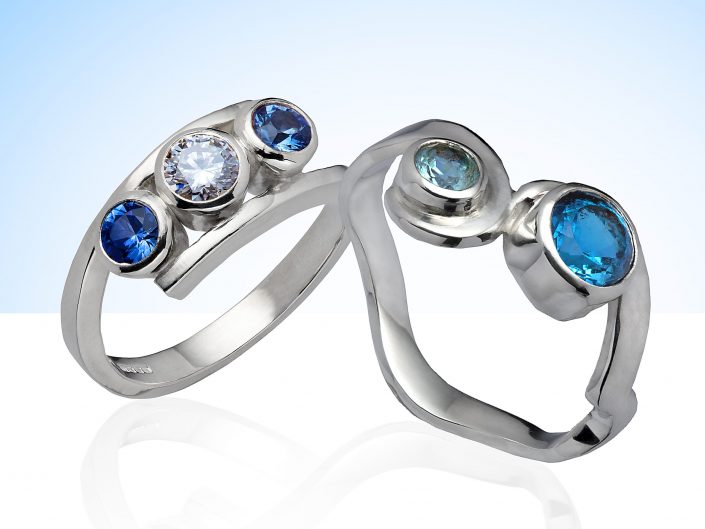 Silver Rings With Diamond and Blue Stone Settings, photographed in an Hull, East Yorkshire photographic studio.