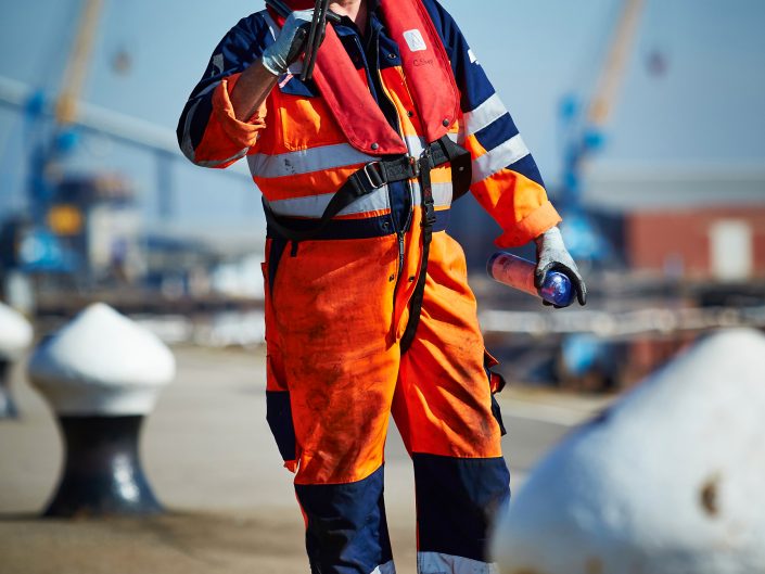 Industrial photograph showing a worker at a Hull port.