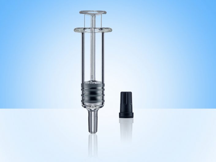 Glass Pipette, Black Cap on Blue Background, photographed for a client in a East Yorkshite product photography studio.