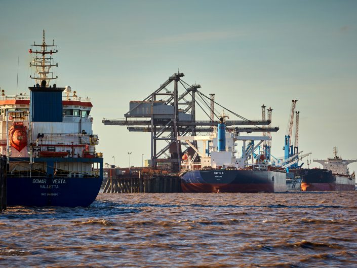 Industrial marine photograph of ships discharging cargo at a bulk terminal on the river Humber, East Yorkshire.