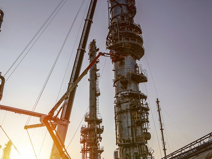 Crane lifting a stack in an industrial chemical works in Hull, East Yorkshire.