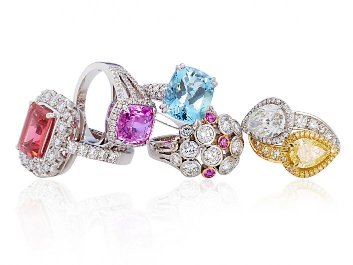 Jewellery photograph of precious stone and diamond rings.